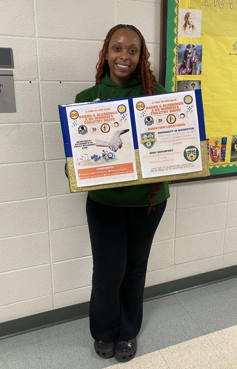 Ariyana Feazell shows off one of the donation boxes located in the Joey Jackson Intercultural Center on Thursday, Nov. 21, 2024.