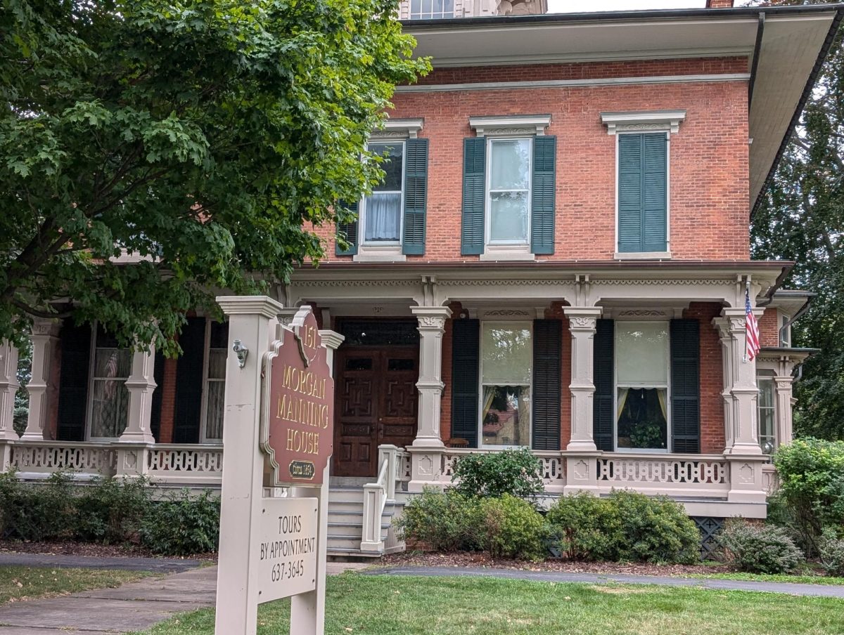 Front of Morgan Manning house with the sign and tree