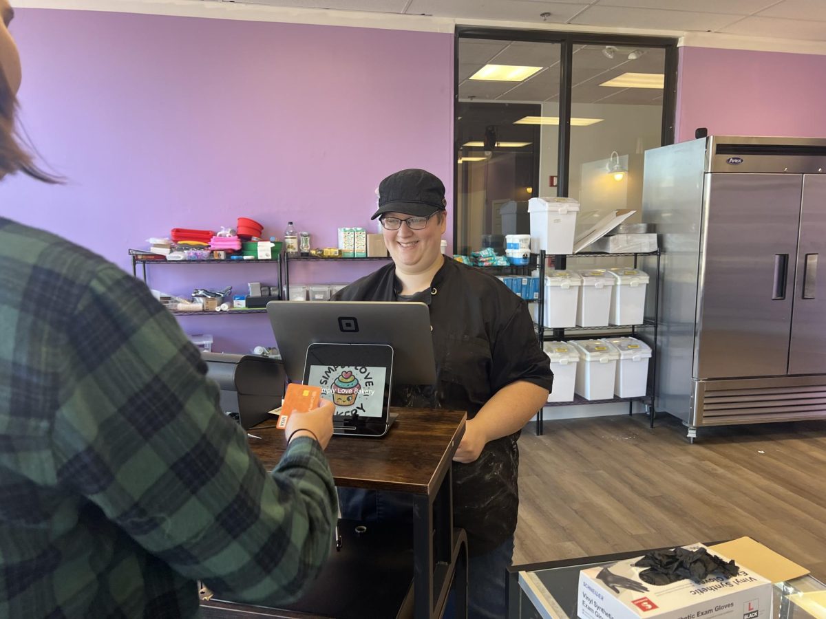 Fran Rezek smiles while cashing out a customer who just purchased a fresh cookie, Oct. 17, 2024