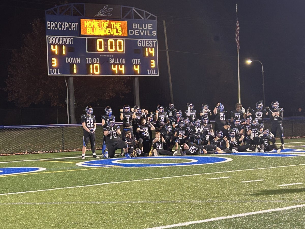 The Brockport Blue Devils celebrating their victory.