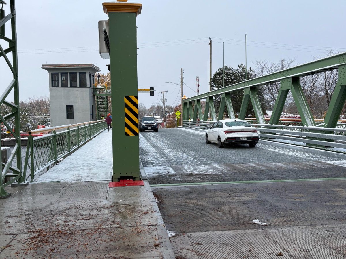 Cars driving on the Main Street bridge in Brockport, N.Y. (Photo: Jason Manuse)